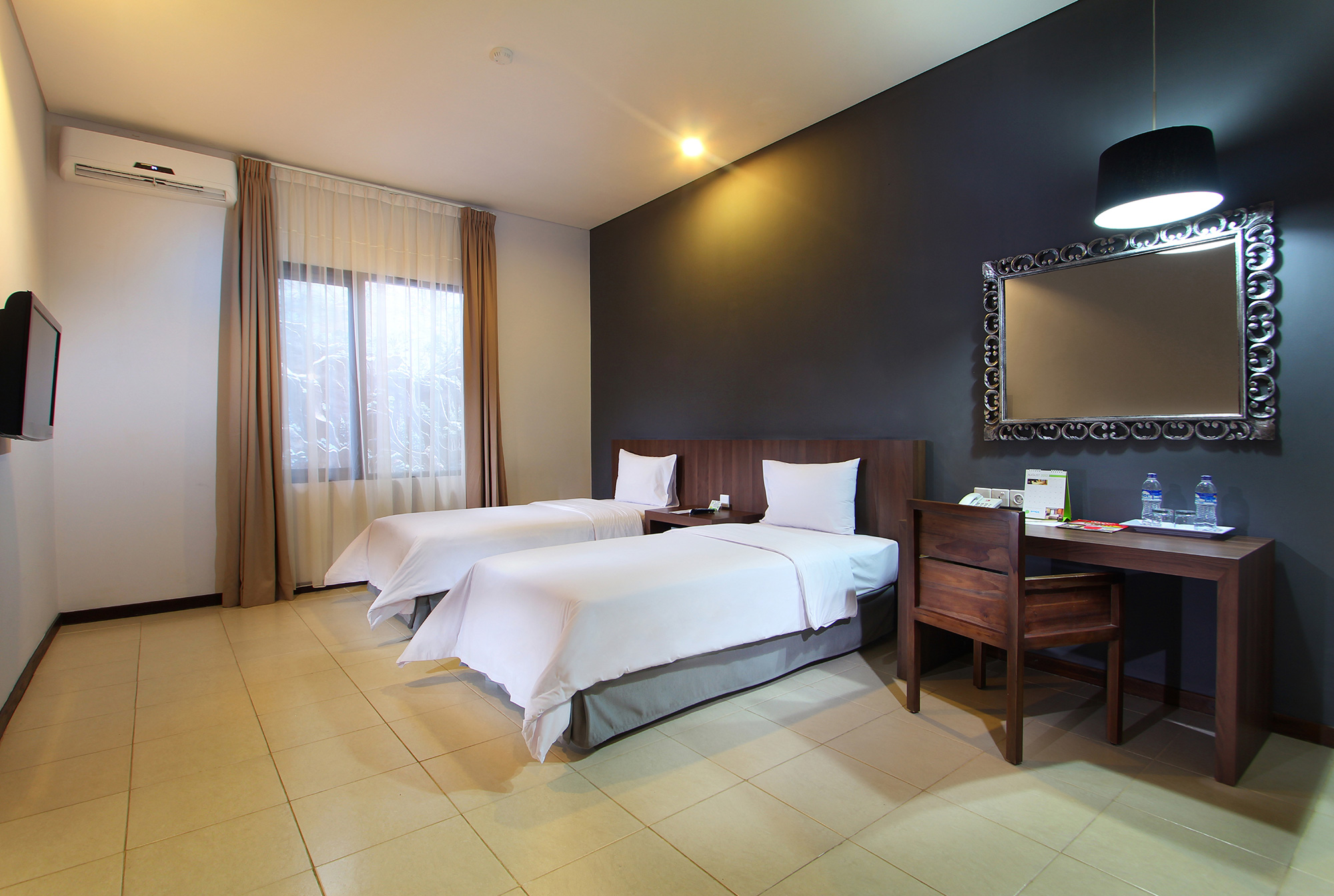 Two comfortable single beds in the Deluxe Twin